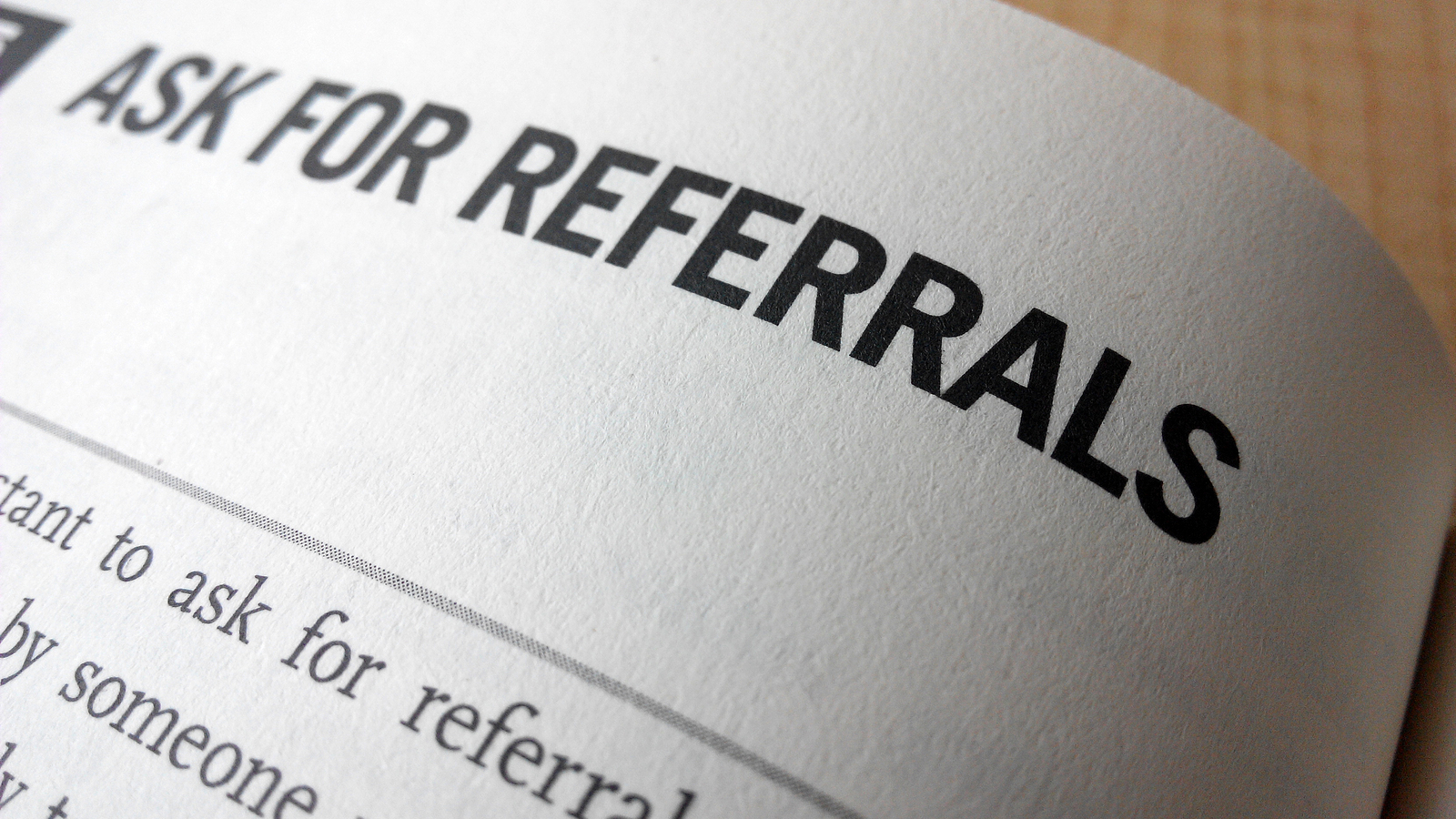 Ask For Referrals Word On A Book